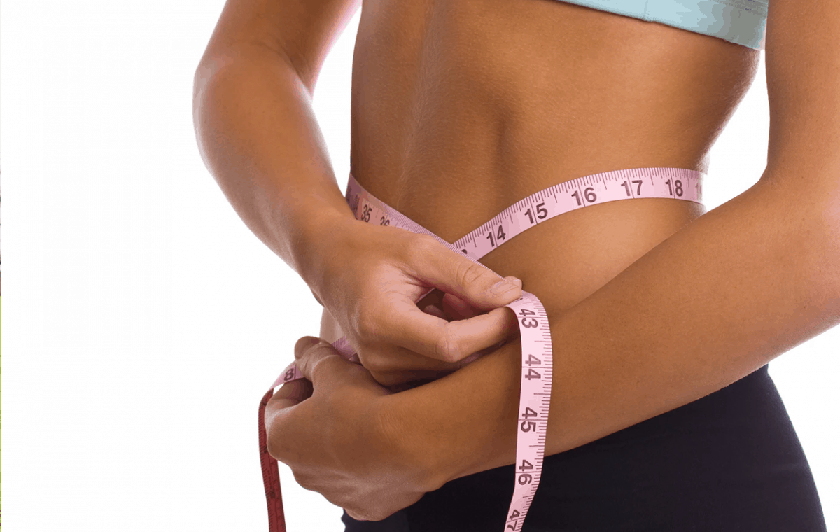 woman measuring fat