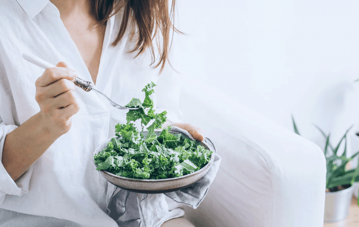 woman eating greens